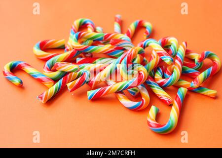 mini cherry candy canes on white background  Stock Photo
