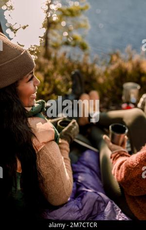 Happy woman looking away during camping Stock Photo