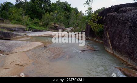 Natural Scenery Above The Rocks And River Flowing Beneath The Surface Stock Photo