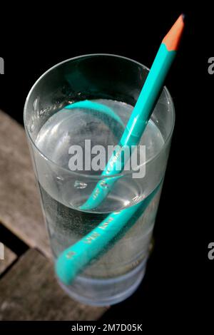 Refraction in a glass of water - Stock Image - C023/0648 - Science