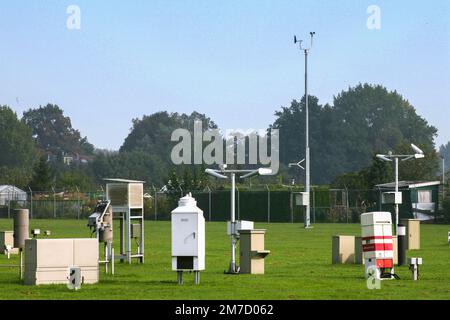 Netherlands - Meteorologist uses various measuring instruments that are set up in a meadow at a weather station Stock Photo