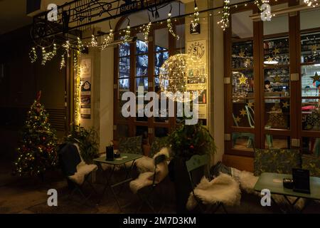 12.10.2022 - Hallstatt, Austria - Cozy resaturant outdoor setting table and chairs Simple . Stock Photo