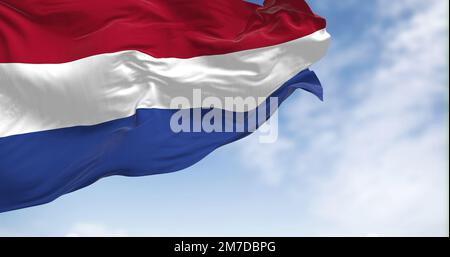 The national flag of the Netherlands waving in the wind on a sunny day. Flag with red, white, and blue stripes. European country. Realistic 3D illustr Stock Photo