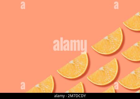Fruit composition. Sliced oranges on bright colorful background. Juicy ripe citrus fruits lying in rows. Minimal style photo with copy space Stock Photo