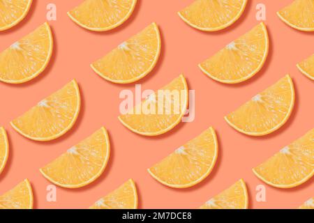 Colorful seamless pattern of fresh orange slices on bright background.   Top view photo with cutted juicy citrus fruits on colorful backdrop Stock Photo