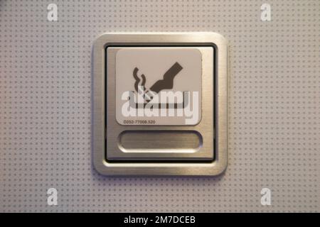 Ash tray / ashtray and No Smoking sign in toilet / loo / lavatory / WC in an Airbus A321 plane / aeroplane / airplane / aircraft. (133) Stock Photo