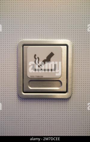 Ash tray / ashtray and No Smoking sign in toilet / loo / lavatory / WC in an Airbus A321 plane / aeroplane / airplane / aircraft. (133) Stock Photo