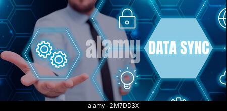 Writing displaying text Data Sync. Concept meaning data that is continuously generated by different sources Stock Photo