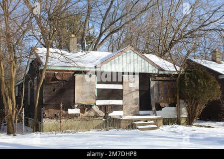 Abandoned home stripped of its siding in winter at Brightmoor in Detroit Stock Photo