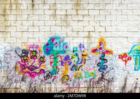 graffiti on the side of a old retail building in Fishkill, NY Stock Photo