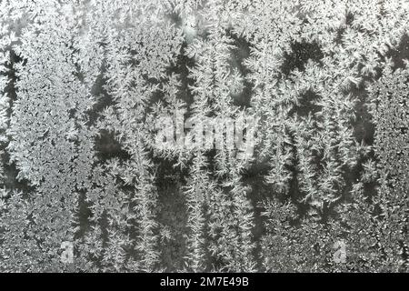 Ice crystal patterns on vehicle glass. Close up. Stock Photo