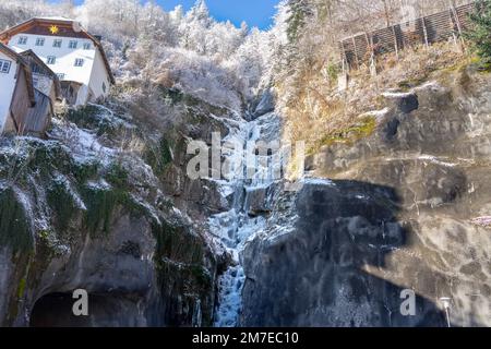 icy frozen waterfall in Hallstatt Austria winter time . Stock Photo