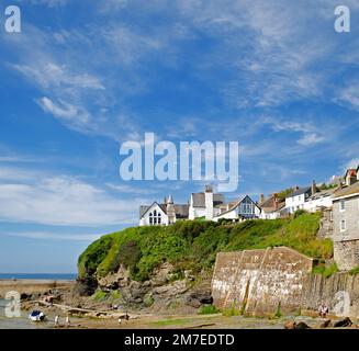 Port Isaac buildings on cliff overlooking the beach in Cornwall, England Stock Photo
