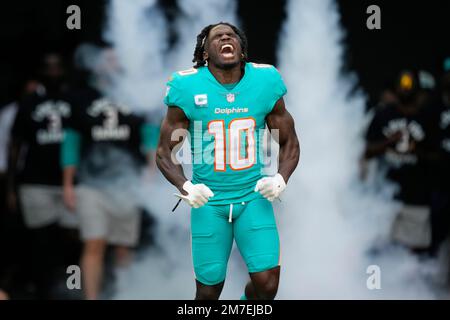 Miami Dolphins wide receiver Tyreek Hill (10) reacts as he is introduced  before the first half of an NFL football game against the New York Jets,  Sunday, Jan. 8, 2023, in Miami