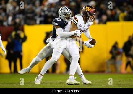 Dallas Cowboys linebacker Damone Clark (33) tackles Washington Commanders  tight end Logan Thomas (82) during the first half an NFL football game,  Sunday, Jan. 8, 2023, in Landover, Md. (AP Photo/Nick Wass Stock Photo -  Alamy