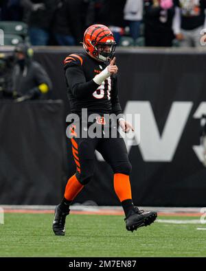 Cincinnati Bengals defensive end Trey Hendrickson (91) is led off