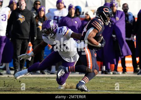 Minnesota Vikings' Esezi Otomewo (90) and Khyiris Tonga celebrate an  interception during an NFL football game against the Chicago Bears Sunday,  Jan. 8, 2023, in Chicago. (AP Photo/Charles Rex Arbogast Stock Photo - Alamy