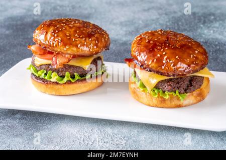Two hamburgers on the plate close up Stock Photo