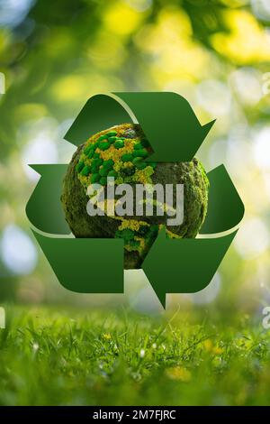 Green planet Earth with recycling symbol. Concept  Stock Photo