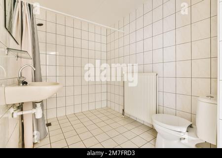 https://l450v.alamy.com/450v/2m7frd3/a-bathroom-with-white-tiles-on-the-walls-and-floor-along-with-a-toilet-in-the-wall-is-made-out-of-black-and-white-2m7frd3.jpg