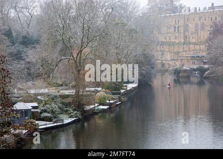 The river Avon as it passes below Warwick castle in the Warwickshire town of Warwick,after a light winter snow fall Stock Photo