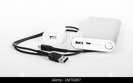 Portable phone charger, cable, USB plug, wire, cord. Travel kit for smartphone charging. High quality photo Stock Photo