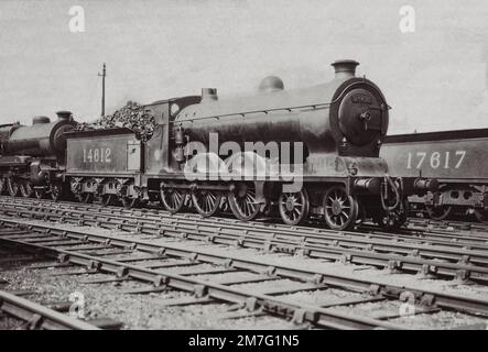 Caledonian Railway 908 Class 4-6-0  No.911 as LMS 14612 with part of a River 4-6-0 and the tender of  812 class 0-6-0 No. 17617 Stock Photo