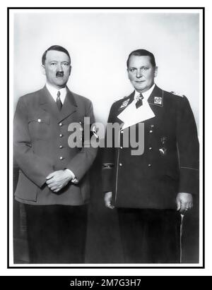 Adolf Hitler and Hermann Goering in uniform 1930s posing together for a formal half length portrait by photographer Heinrich Hoffmann Stock Photo