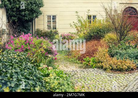 Garden in old town centre.Autumn season. Stock Photo