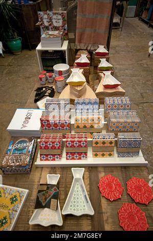 Traditional decorated tiles (azulejos) and other sovenirs for sale, Lisbon, Portugal Stock Photo