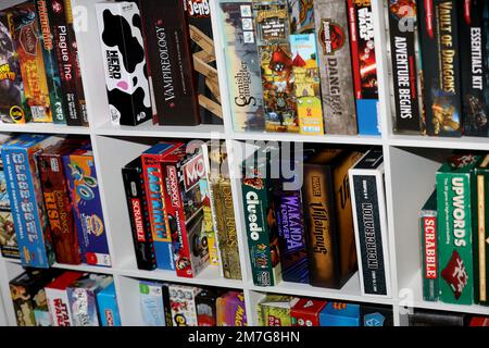 A shelf of board games on display to play in Havant, Hampshire, UK. Stock Photo
