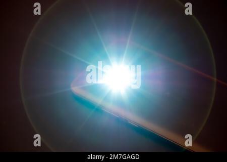 LED Flash or Flashlight of a Smartphone on black background Stock Photo