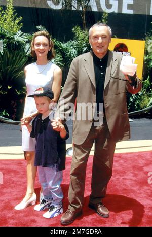 Dennis Hopper & his son attending the opening of Jurassic Park at the Universal Studios Tour in 1996 Credit: Ron Wolfson  / MediaPunch Stock Photo