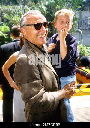 Dennis Hopper & his son attending the opening of Jurassic Park at the Universal Studios Tour in 1996 Credit: Ron Wolfson  / MediaPunch Stock Photo