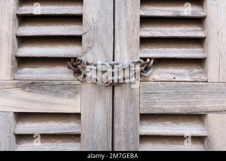 Locked old window shutters Stock Photo