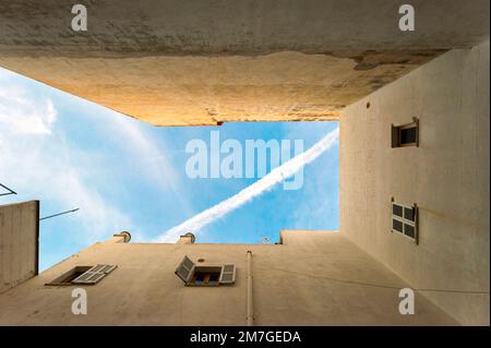 View from a backyard into the blue sky. Stock Photo