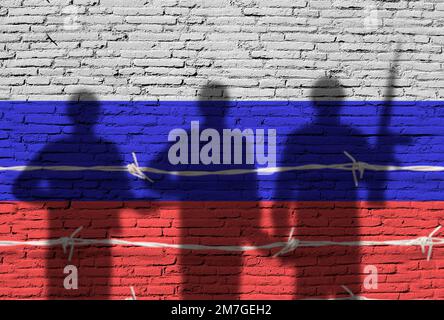Flag of Russia painted on a brick wall with soldiers shadows.War between Ukraine and Russia Stock Photo