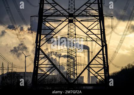 High-voltage power lines, overhead line pylons, UNIPER Scholven coal-fired power plant in the background, wind turbines on the Oberscholven slag heap, Stock Photo