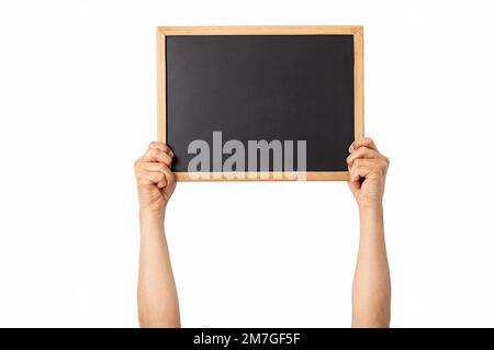 Man holding up small blackboard with white background and copy space. Stock Photo