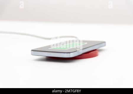 Close up of a smartphone being charged Stock Photo
