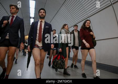 London, UK. 08th Jan, 2023. Participants with no trousers walk in a subway. Over 100 participants took part in the annual No Trousers Tube Ride event in central London. The event returns following the Covid-19 pandemic. The event celebrates its 12th anniversary in London this year. (Photo by Steve Taylor/SOPA Images/Sipa USA) Credit: Sipa USA/Alamy Live News Stock Photo