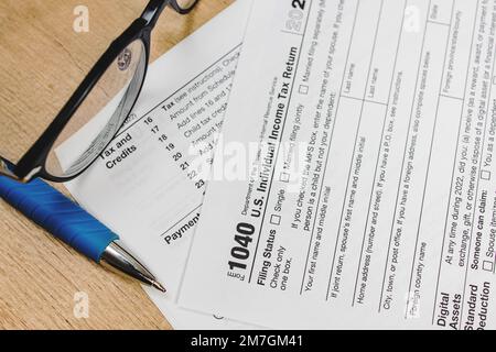 Pen on US individual tax form. Filling tax forms for season Stock Photo