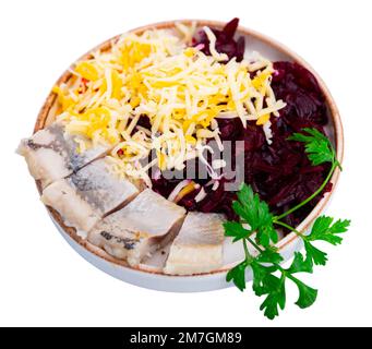Sliced herring with grated beetroot and cheese served on table Stock Photo