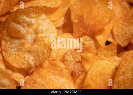 tasty crispy potato chips background Stock Photo