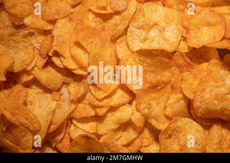 tasty crispy potato chips background Stock Photo