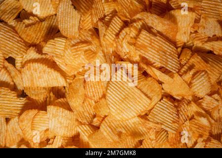 tasty crispy potato chips background Stock Photo