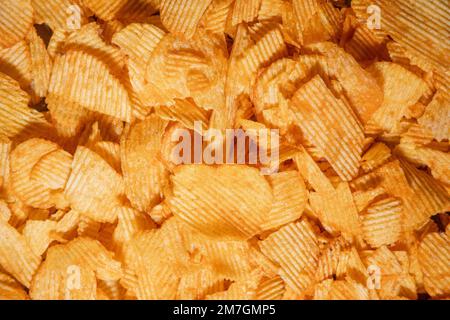 tasty crispy potato chips background Stock Photo