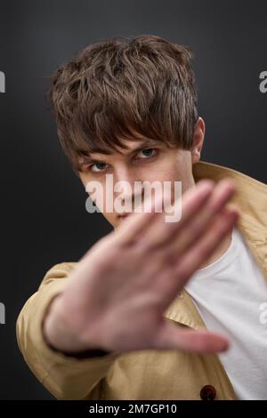 man doing stop sing with palm of the hand Stock Photo