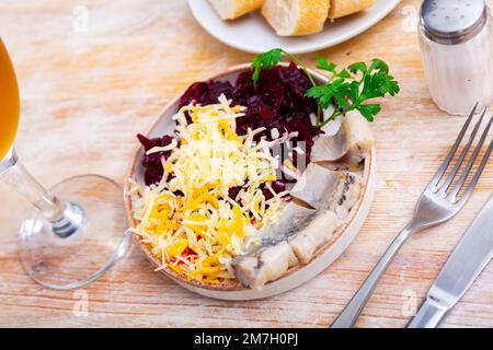 Beetroot served with cheese and pickled mackerel Stock Photo