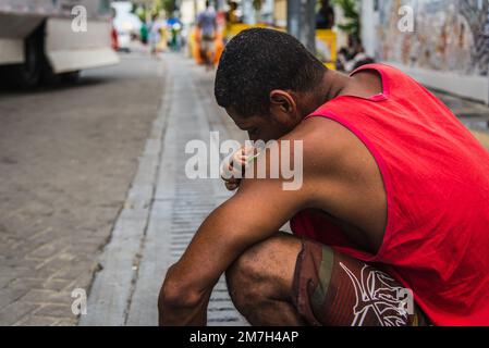 Salvador, Bahia, Brazil - February 09, 2018: People washing in the street after Carnival night in the city of Salvador, Bahia. Stock Photo